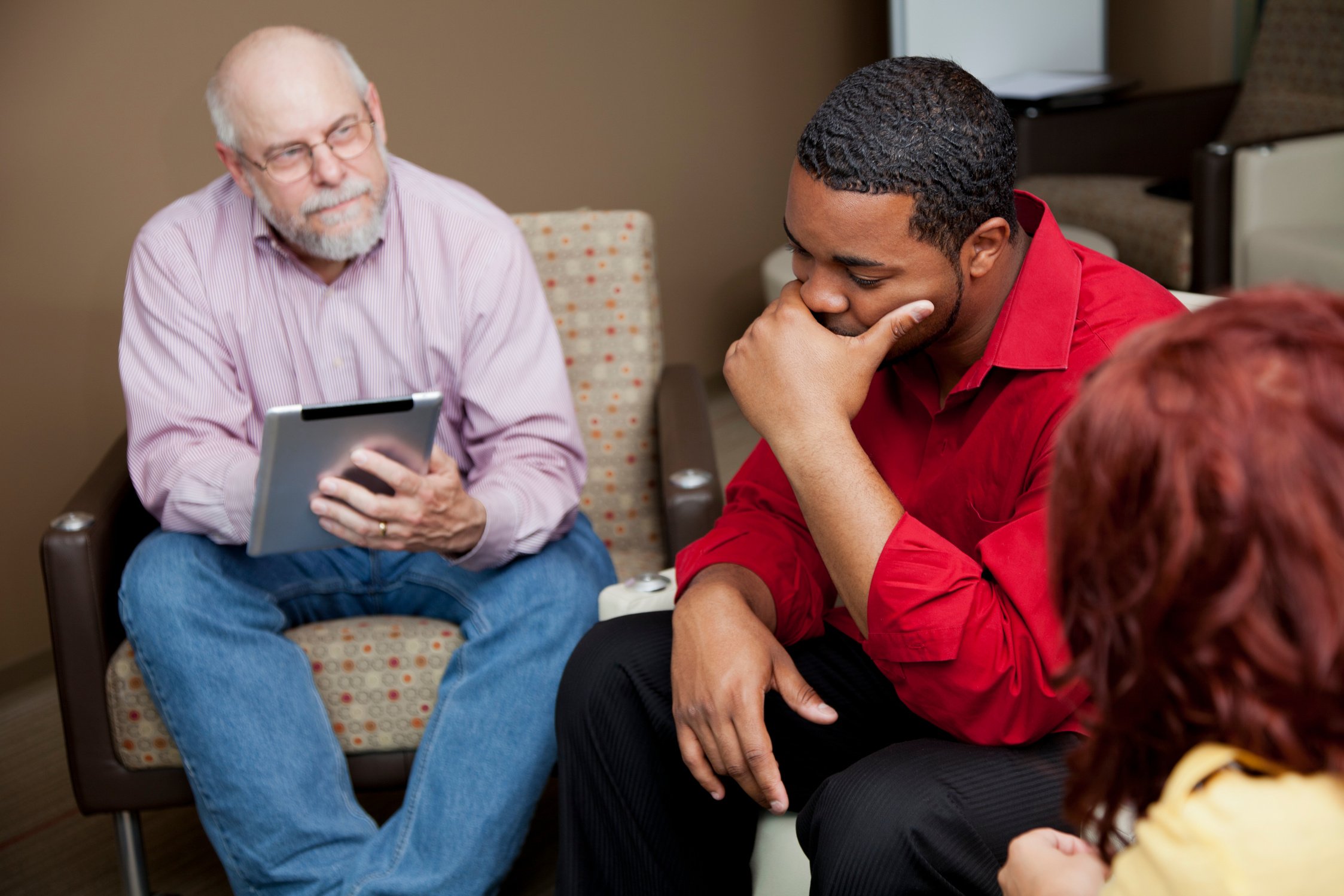 Upset man at a group therapy